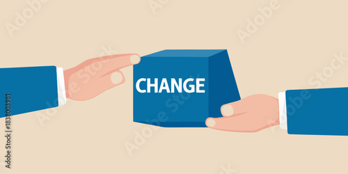 Hands exchanging a blue cube with the word change written on it