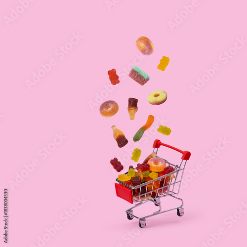 Wallpaper Mural falling jelly beans into a shopping cart, representing a sweet treat purchase Torontodigital.ca