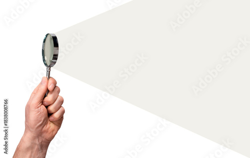 Cloud Dancer, trendy off-white color of the Year 2026. hand holding a magnifying glass casting a