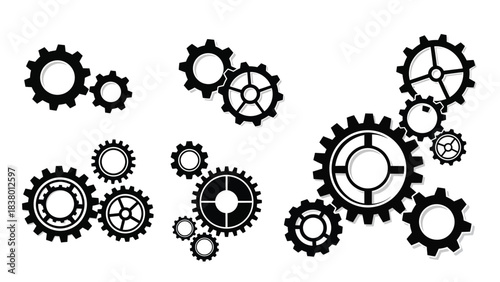 An arrangement of various sized black gears on a plain white background