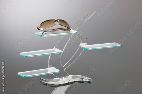 Modern acrylic sunglasses display stand with glass shelves