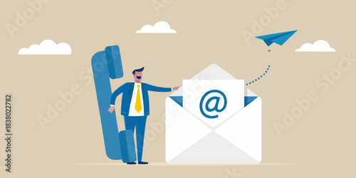 Communicating through technology a man sending an email via a telephone