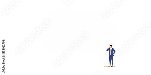 A businessman standing near a large blank speech bubble on a black background