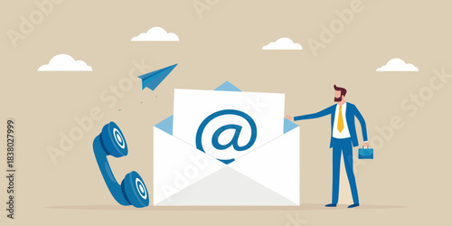 Man sending an email with a phone nearby representing digital communication