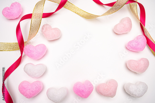 Valentine's Day background with pink heart and red-gold ribbon