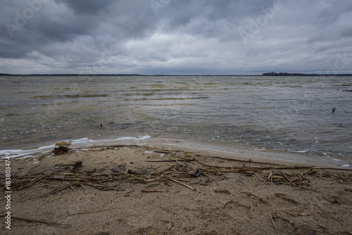 Lake in windy and cloudy weather. Autumn