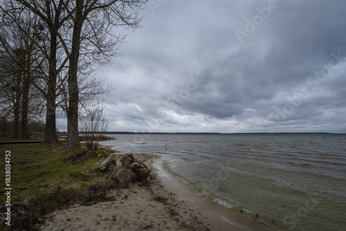 Lake in windy and cloudy weather. Autumn