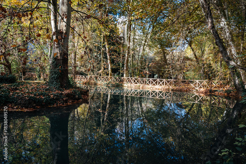 Wooden bridge and reflections in the water at Monasterio de Piedra, Spain