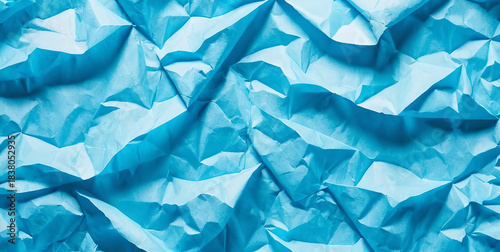 Background made of crumpled and torn blue paper
