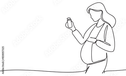 Pregnant Woman Examining Medication Bottle for Safety