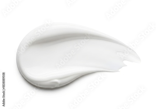 Swirl of thick white cosmetic substance shows smooth texture against a clean background