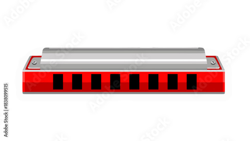 Close up of a red harmonica with a metallic silver top and black holes isolated on a black background
