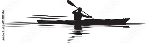 Silhouette of a person kayaking on water with reflection