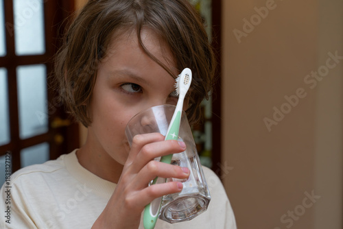 Slika na platnu Young boy brushing his teeth