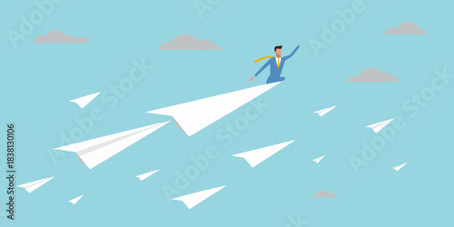 A businessman flies through the air on a paper airplane achieving success