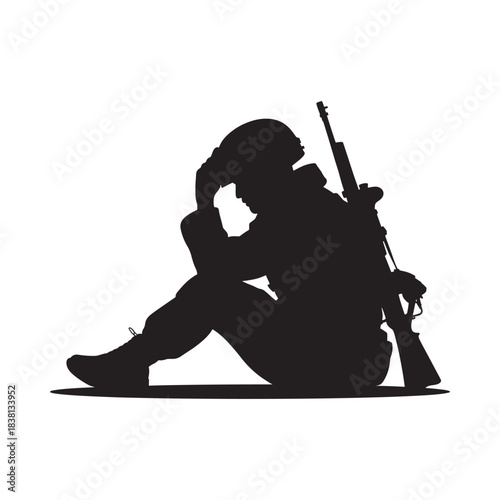 Silhouette of a soldier sitting with head in hands rifle nearby