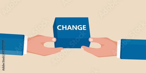 Hands holding a blue card with the word change written on it