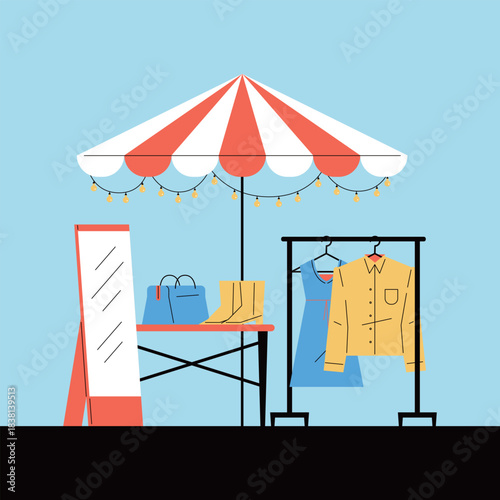 Outdoor Market Stall with Clothing and Accessories. Flea market. Second-hand goods sales.