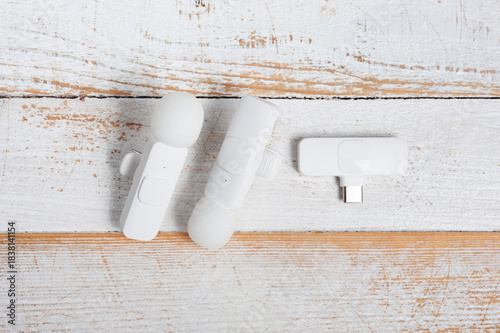 Two wireless microphones and a transmitter for your phone.