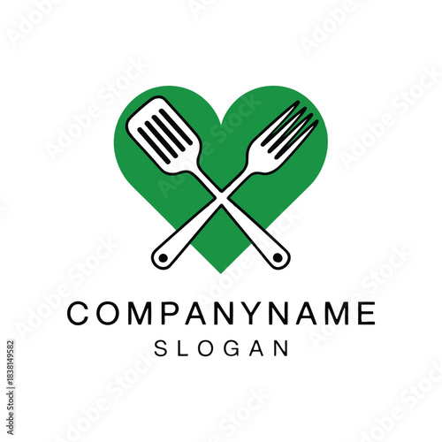 Creative emblem featuring a vivid green heart with stylishly crossed white cooking utensils, a spatula and fork, symbolizing wholesome food and culinary delight for a healthy lifestyle brand