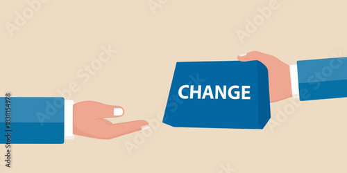 Hands exchanging a box labeled change symbolizing transformation and progress