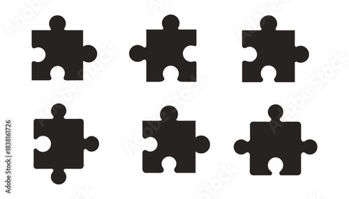 Six black puzzle pieces arranged in two rows for teamwork concept