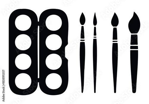 Collection of black silhouette watercolor paint pans and brushes for creative drawing and painting applications in art studios and schools