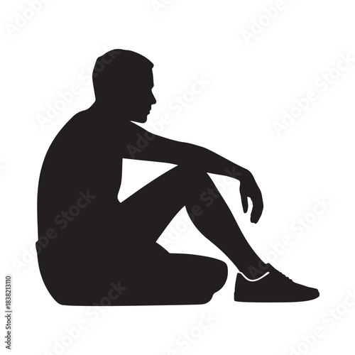 A solitary figure seated on the ground depicted in a striking black silhouette