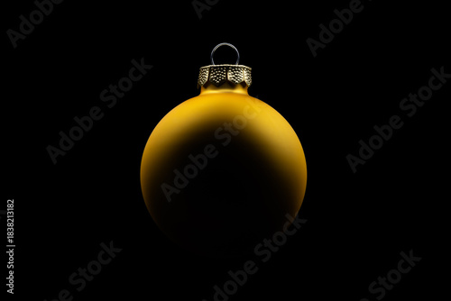 Golden Christmas ball isolated on black background
