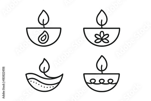Four traditional Diya oil lamps with decorative elements for the Diwali festival