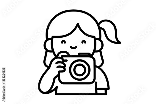Smiling young girl holding compact camera taking photo