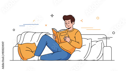 Young caucasian male relaxing and reading a book on couch