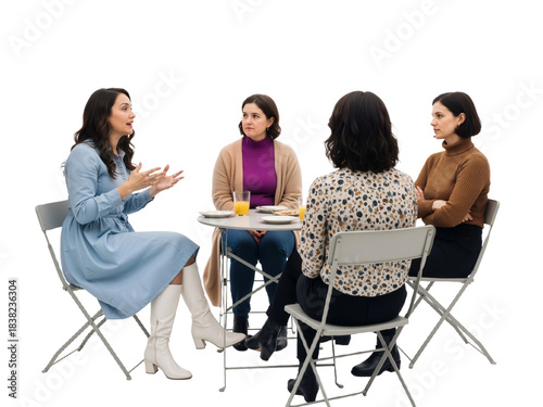 Four Women in Conversation – A Moment of Connection and Camaraderie at a Round Table

