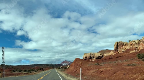 POV road trip through Utah and Arizona along Route 12 and Highway 95, with scenic canyons, mesas, red rocks and desert landscapes. Horizontal and vertical footage.