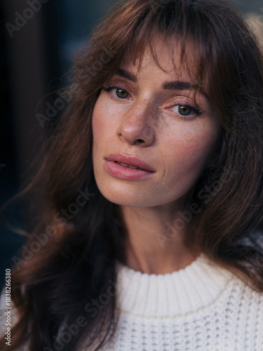 Close-up portrait of thoughtful young woman with beautiful eyes