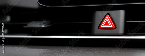 Close-up view of a car dashboard with a hazard lights button. Emergency lights caused by a broken car. concept transport travel. 