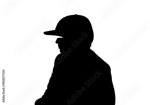 Silhouette of a person wearing a baseball cap against a transparent background, viewed from the side.
