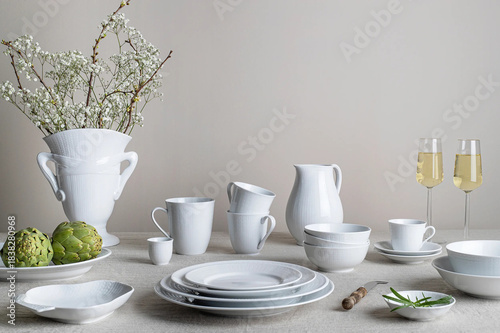 Tableau sur toile beautifully set served table with white dishes, bouquet of flowers, elegant rest