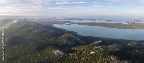 View of Vrana Lake and the coast with islands behind it, Vransko Lake nature park Park, Dalmatia, Croatia
