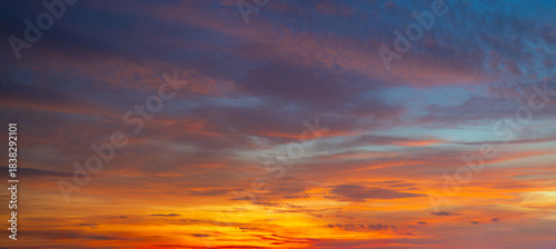 Clouds and sky at sunrise and sunset,Clouds and sky at sunrise and sunset,Sunset sky clouds in the evening with Orange gold sunlight in golden hour, Panoramic Horizon sky background  