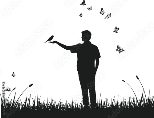 Silhouette of man holding bird in peaceful nature scene with butterflies flying around in grassy outdoor landscape, wildlife harmony