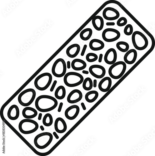 Rectangular piece of tempeh, a traditional indonesian food made from fermented soybeans, with its characteristic textured appearance