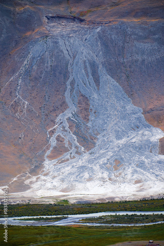 A mountainside eroded by ground waters. The Chagan River flows beneath the mountain slope.
