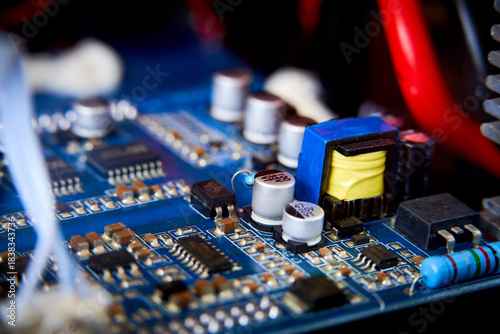 Close-up of electronic circuit board with electronic components. Technology background