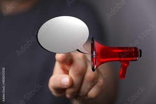 Hand pointing towards a red...