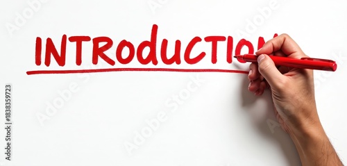 Human hand writes introduction word with red marker on white paper. Presentation starts with intro, new topic launch with preamble. First impression important concept. Project begins from