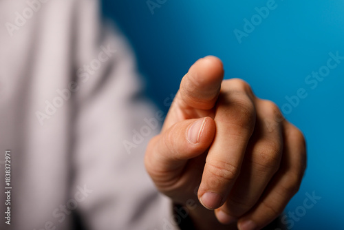 Hand pointing towards the v...
