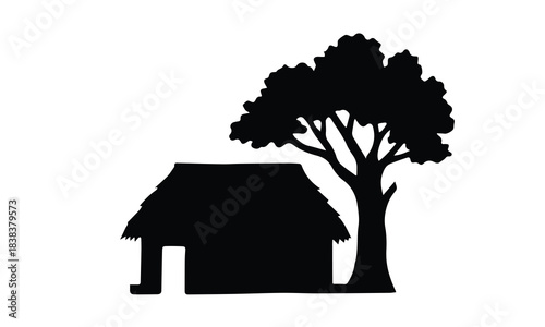 Silhouette of a rustic hut beside a large tree