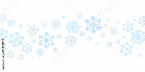 A seamless pattern of delicate light blue snowflakes on a white background