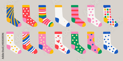 Colorful and patterned socks arranged in rows on a neutral background